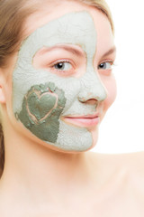 Skin care. Woman in clay mud mask on face. Beauty.