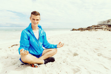 Man training on beach outside