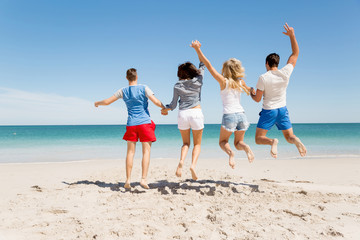 Company of young people on the beach