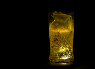 Still Life with a draft beer by the glass on dark background