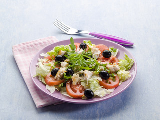 salad with fresh tuna lettuce tomato arugula and olives