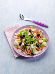 salad with fresh tuna lettuce tomato arugula and olives