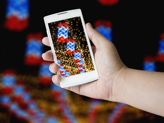 Human hand holding blank mobile smart phone