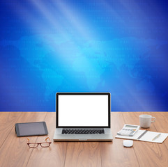 Blank screen laptop computer with blue digital graphics backgrou