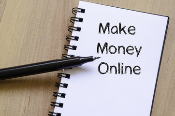 Make money online write on notebook
