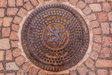 Ornate manhole cover with Bohemian coat of arms  lion