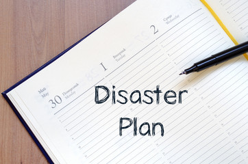 Disaster plan write on notebook