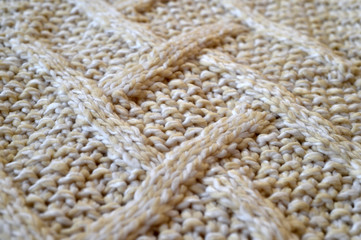  Texture of a knitted beige textile
