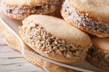 Argentinean dessert: cookies alfajores on a plate macro. horizontal
