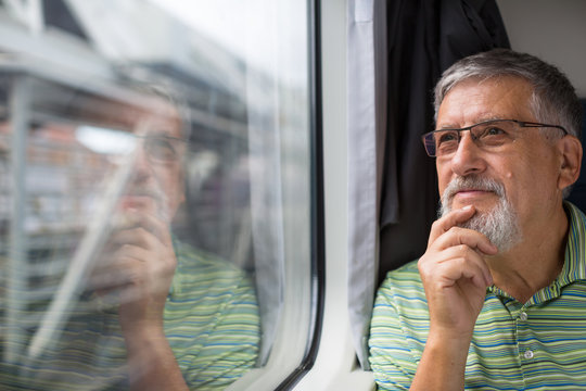 Senior man enjoying a train travel