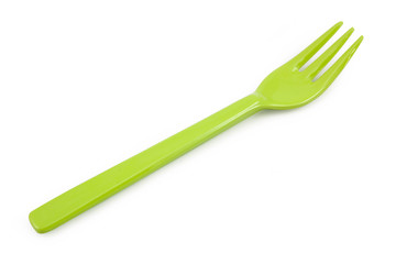 Green plastic forks isolated on white background