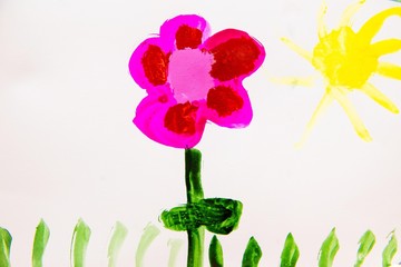 Obraz na płótnie Canvas children's drawing a flower on the sun