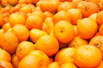 Pile of fresh oranges and mandarins