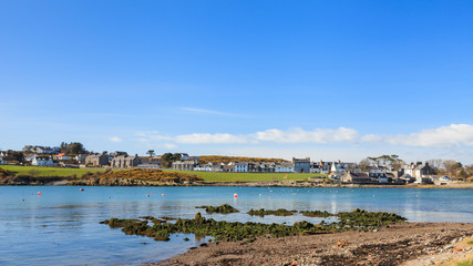 Fototapeta na wymiar Isle of Whithorn Waterfront. The view across Isle of Whithorn Bay to the small coastal village of Isle of Whithorn in Dumfries and Galloway, Southern Scotland.