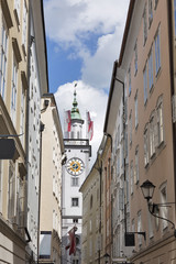 Clock tower of Old Town Hall with flags in Salzburg, Austria, Europe