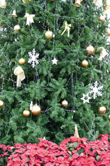 Fototapeta na wymiar christmas tinsel ornament decorating christmas tree for holiday