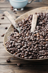 Raw coffee beans on the wooden table