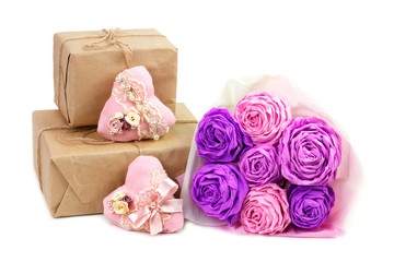 Fototapeta na wymiar Paper pink roses and handmade hearts with gifts for Valentine's Day 