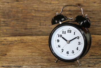 clock bell on the wood background