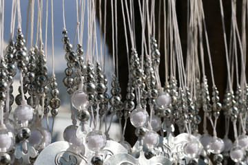 bead decorating on silver Bodhi leaf in buddhist temple