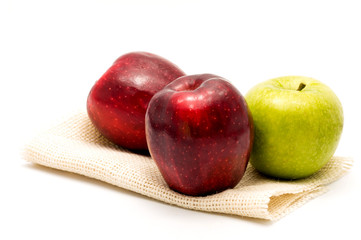 red and green apples over white background