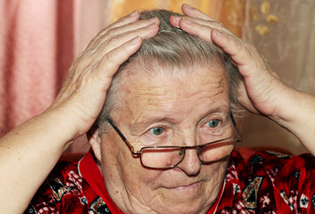 Elderly woman and comb