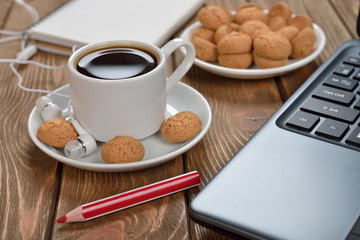 Cup of coffee and a laptop