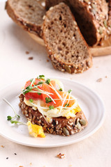 smashed egg and pickled onion on cereal rye bread.