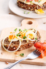 smashed egg and pickled onion on cereal rye bread.