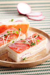 smoked salmon and radish finger sandwiches.