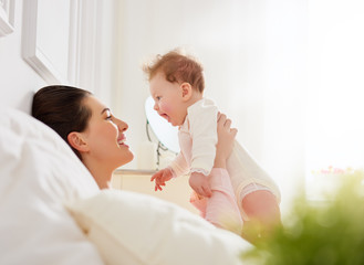 mother playing with her baby