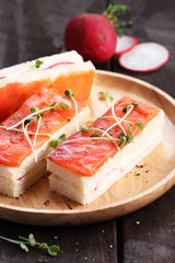 smoked salmon and radish finger sandwiches.