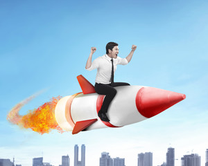 asian business man flying ride rocket