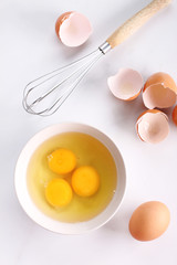 raw eggs in bowl.