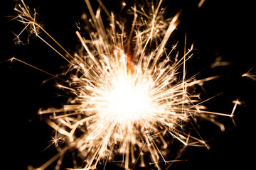 New Year sparkler on black background 