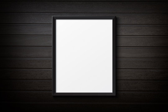 Blank black picture frame on the grunge  plastic background