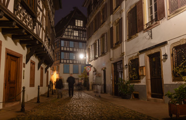 Night old city cobblestones lonely passers