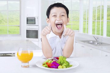 Happy Child with Salad and Juice