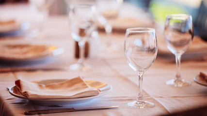The interior of summer cafe - sheltered tables with white tablec