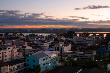 Naklejka premium Sunrise over Mekong River in a Mukdahan city skylin