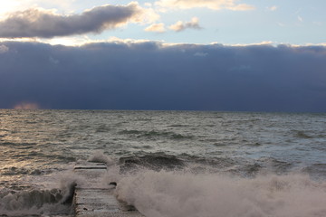 Sea wawes washed dock evening