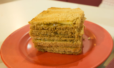 The kaya toast on the red plate close up