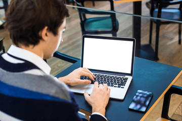 Closeup portrait freelance man using his laptop