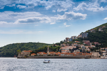 Fototapeta na wymiar View of the old town of Budva, sea bay and mountains distance in summertime.