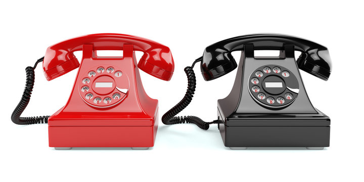 Red and black old-fashioned phones isolated
