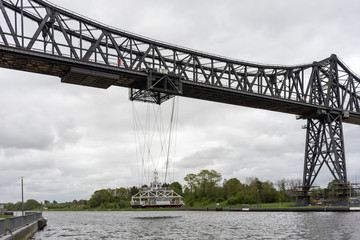 Hanging ferry and Rendsburg High Bridge railway viaduct over the Kiel Canal at Rendsburg in the German state of Schleswig-Holstein.