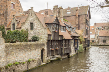 Fototapeta na wymiar Traditional buildings by the canals in Brugge - Belgium.