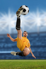 Soccer Player Kicking Ball