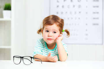 concept vision testing. child  girl with eyeglasses