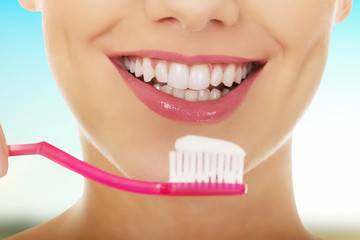 Woman with toothbrush.